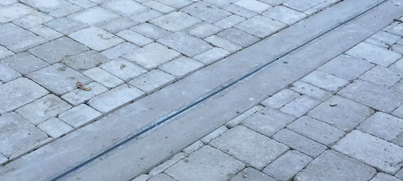Garage Floor Water Diverter Drain on Driveway